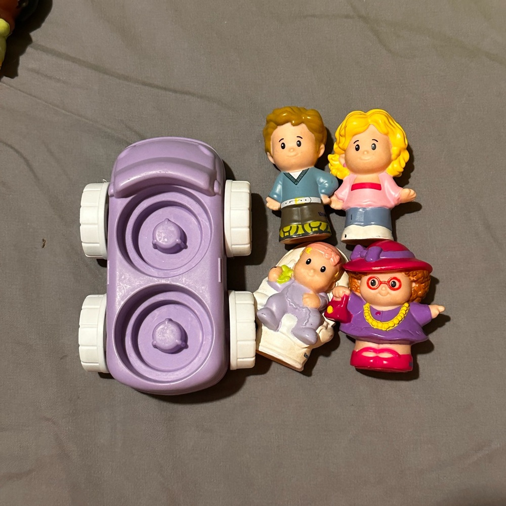 Little people family with car